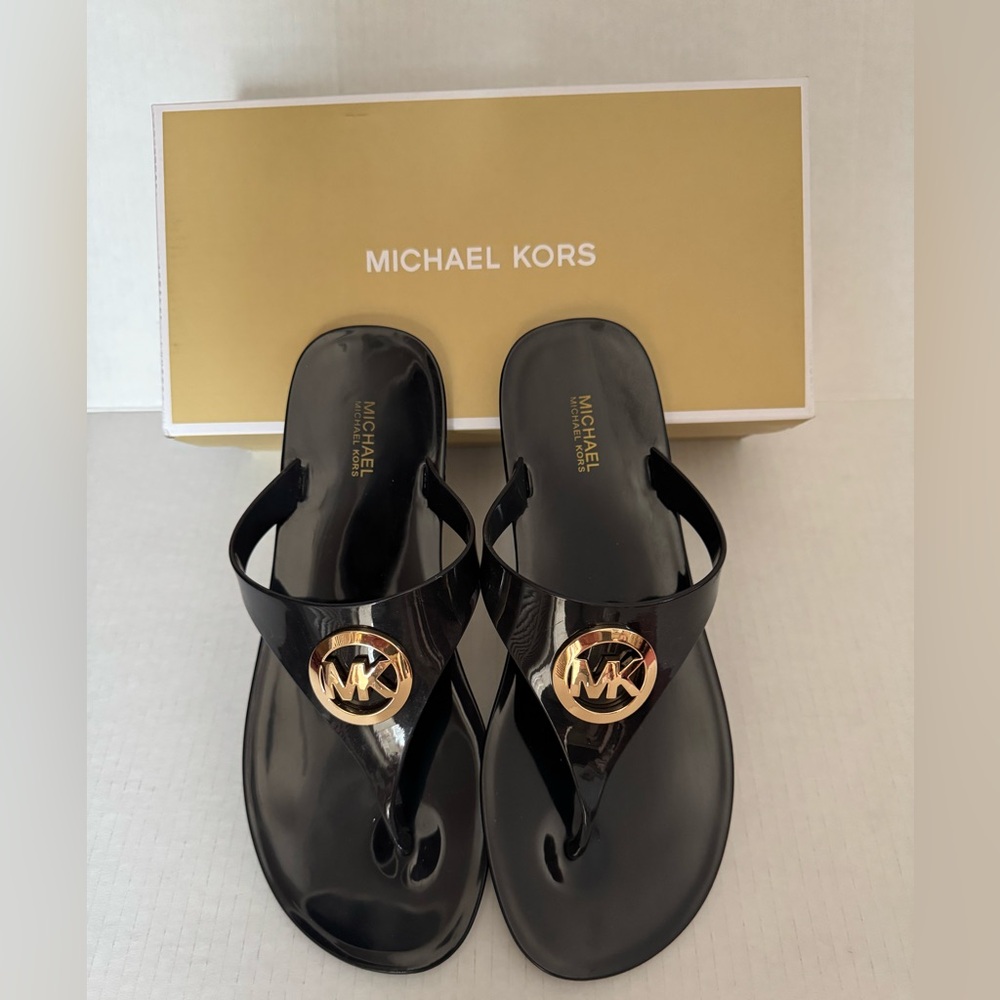 MICHAEL KORS Black rubber women’s Flip Flops
 w/ Gold MK Emblem Size 9. Like new
